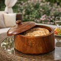 Wooden bread box with lid on a table outdoors