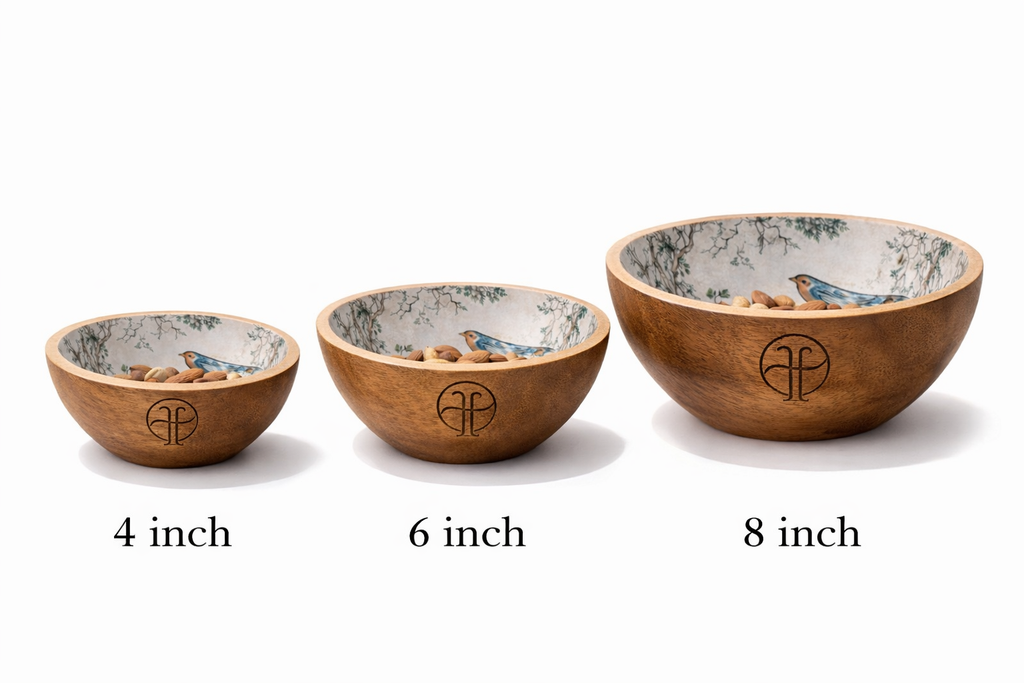 Three wooden bowls with bird design of different sizes with labels on a white background