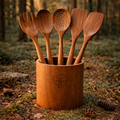 Premium Sheesham wood kitchen utensil set with holder, handcrafted wooden spatula and spoon set displayed in natural forest setting